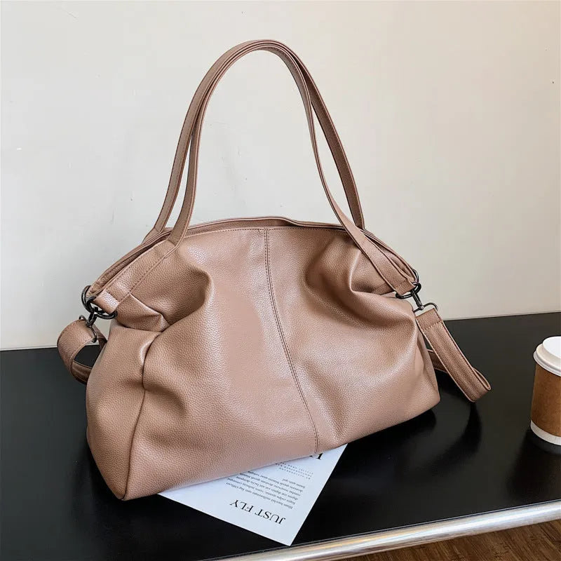 Large soft surface messenger bag in horizontal square shape with adjustable shoulder strap