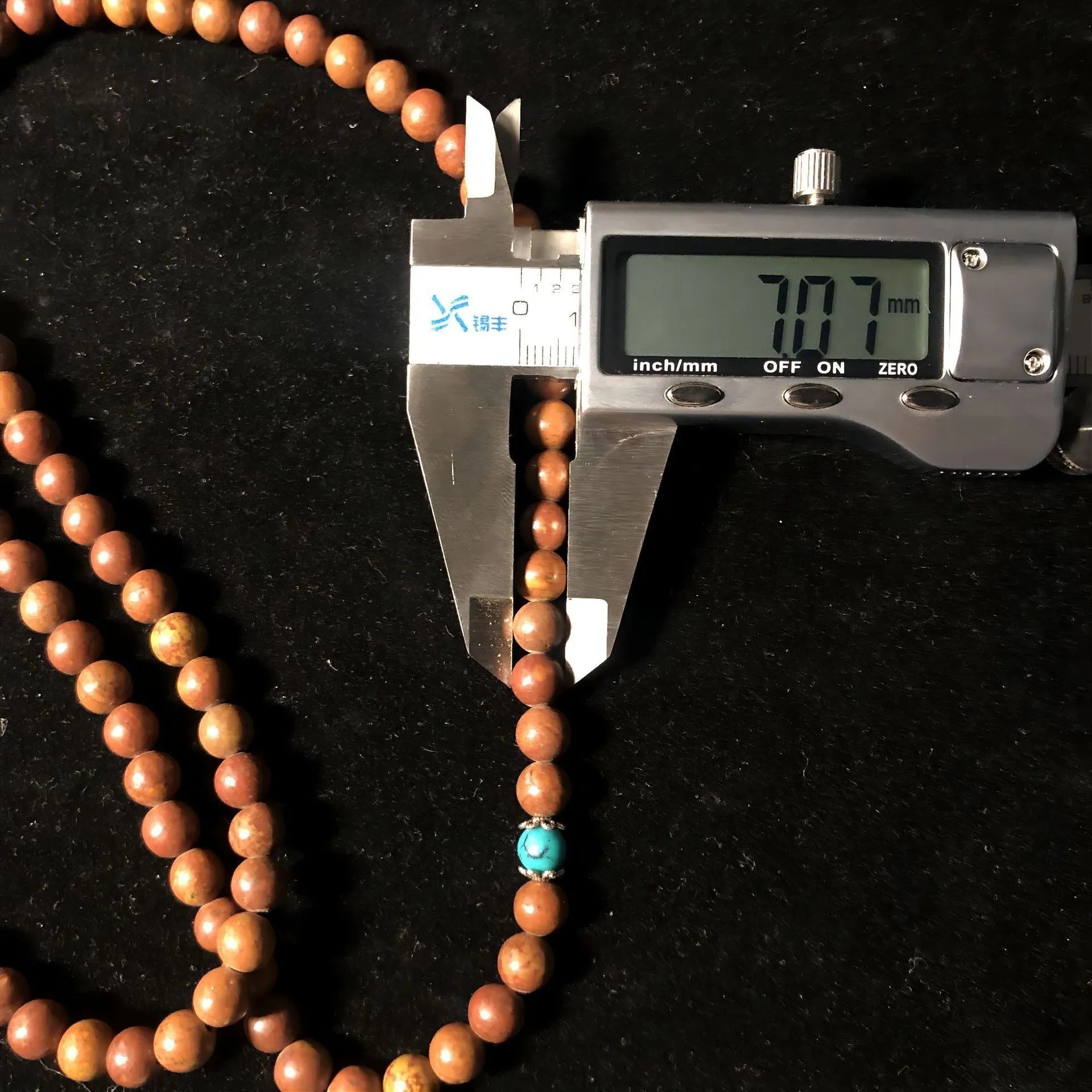 Handmade stone bead bracelet with 108 geometric lvzhu beads measuring 5-6mm