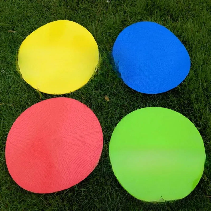 Soft yellow TPE football training disc on grass, showing 23cm diameter flat marker.