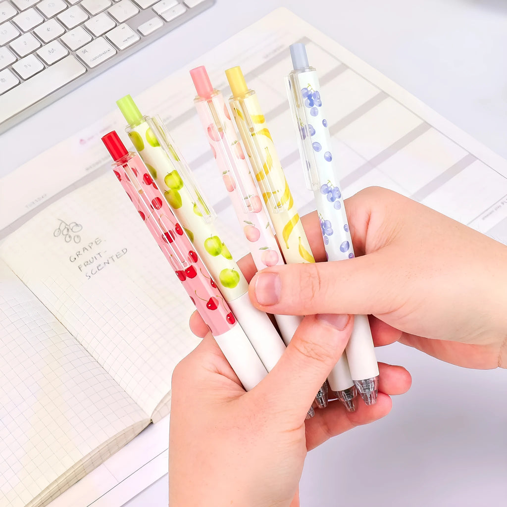 Three fruit scented press-action pens with 0.5mm black refills
