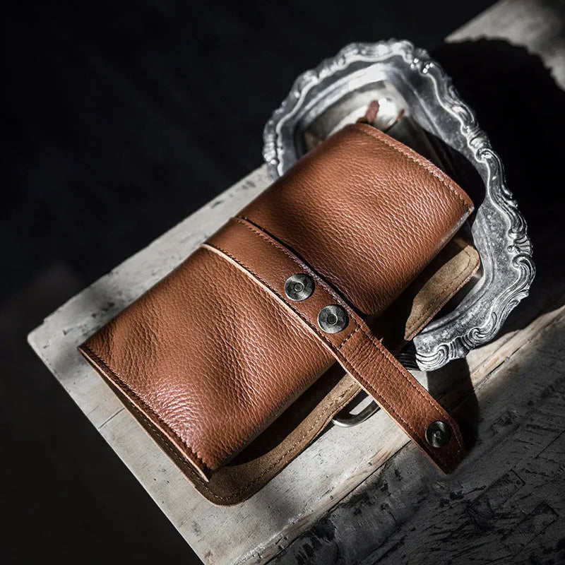 Handmade cow leather vintage wallet showing tape extraction closure and solid colour finish