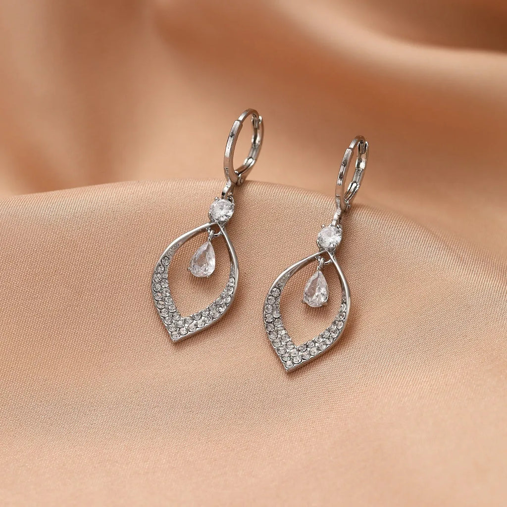 Gold electroplated copper zircon water drop tassel earrings in a teardrop shape