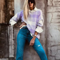 Lilac plaid print loose-fitting long sleeve women's sweater with ribbed trim detail.