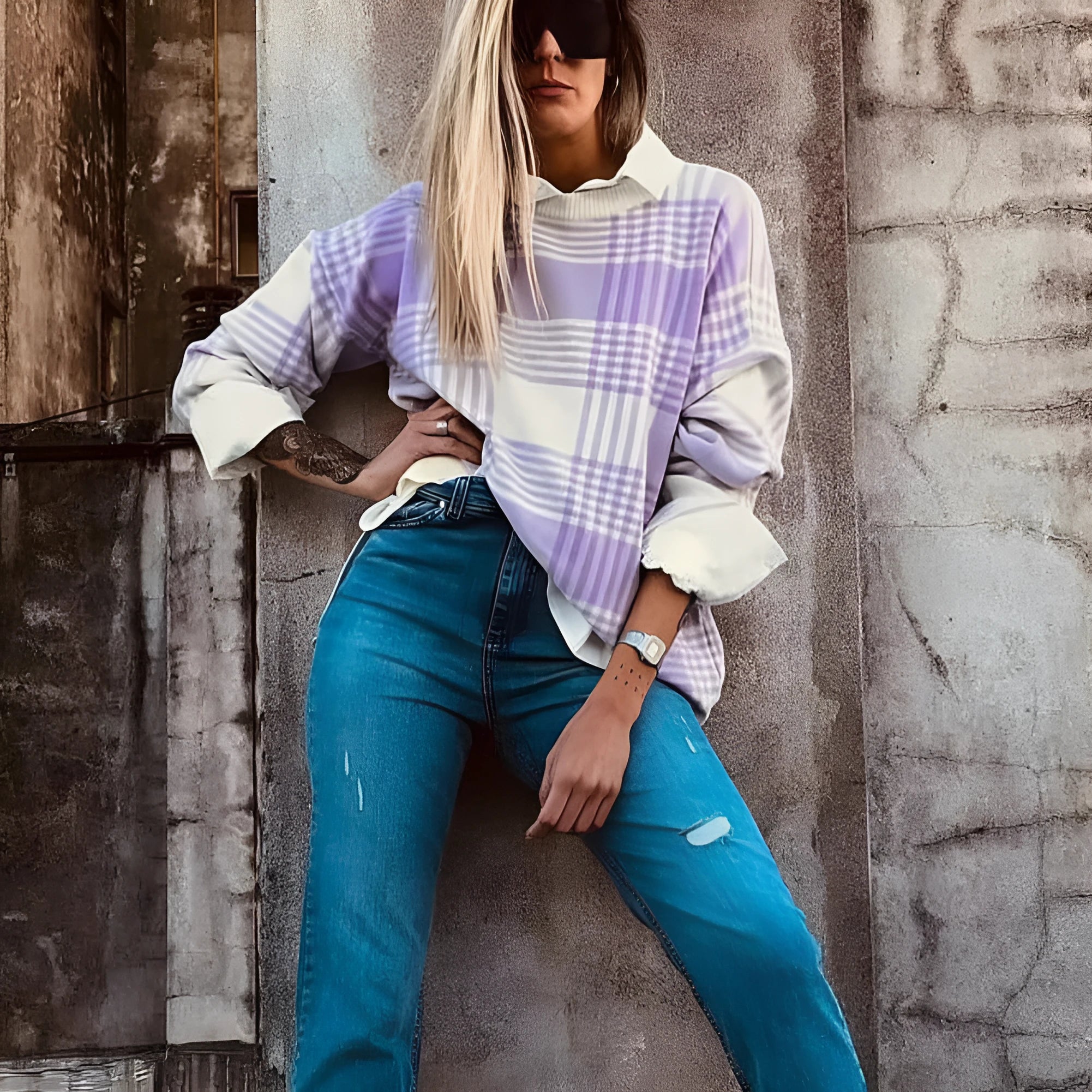 Lilac plaid print loose-fitting long sleeve women's sweater with ribbed trim detail.