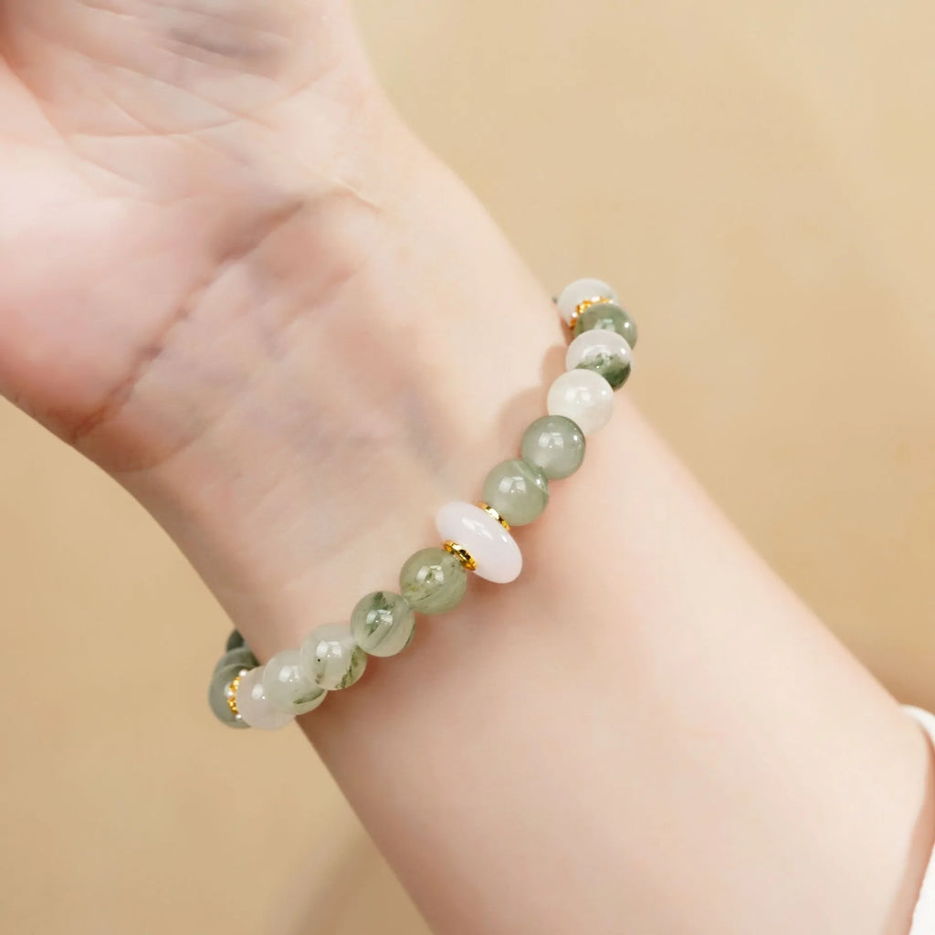 Emerald green Tian Shan Cui stone women's bracelet with floating floral motif and circular pattern