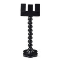Black pet photography clip with rotating treat holder attached to mobile phone