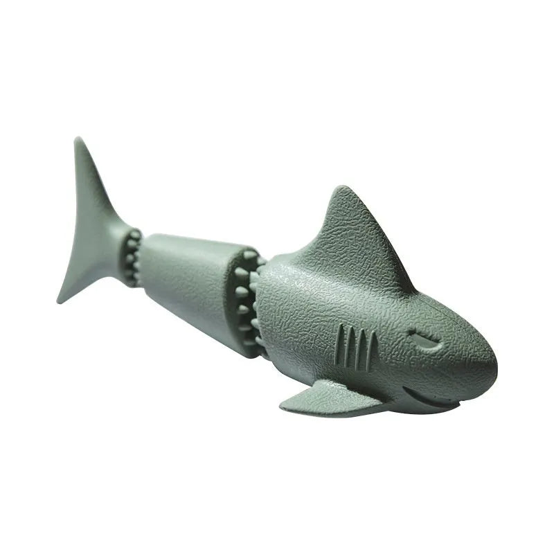 Blue and green rubber dog toys shaped like conch shells and starfish with shark texturing