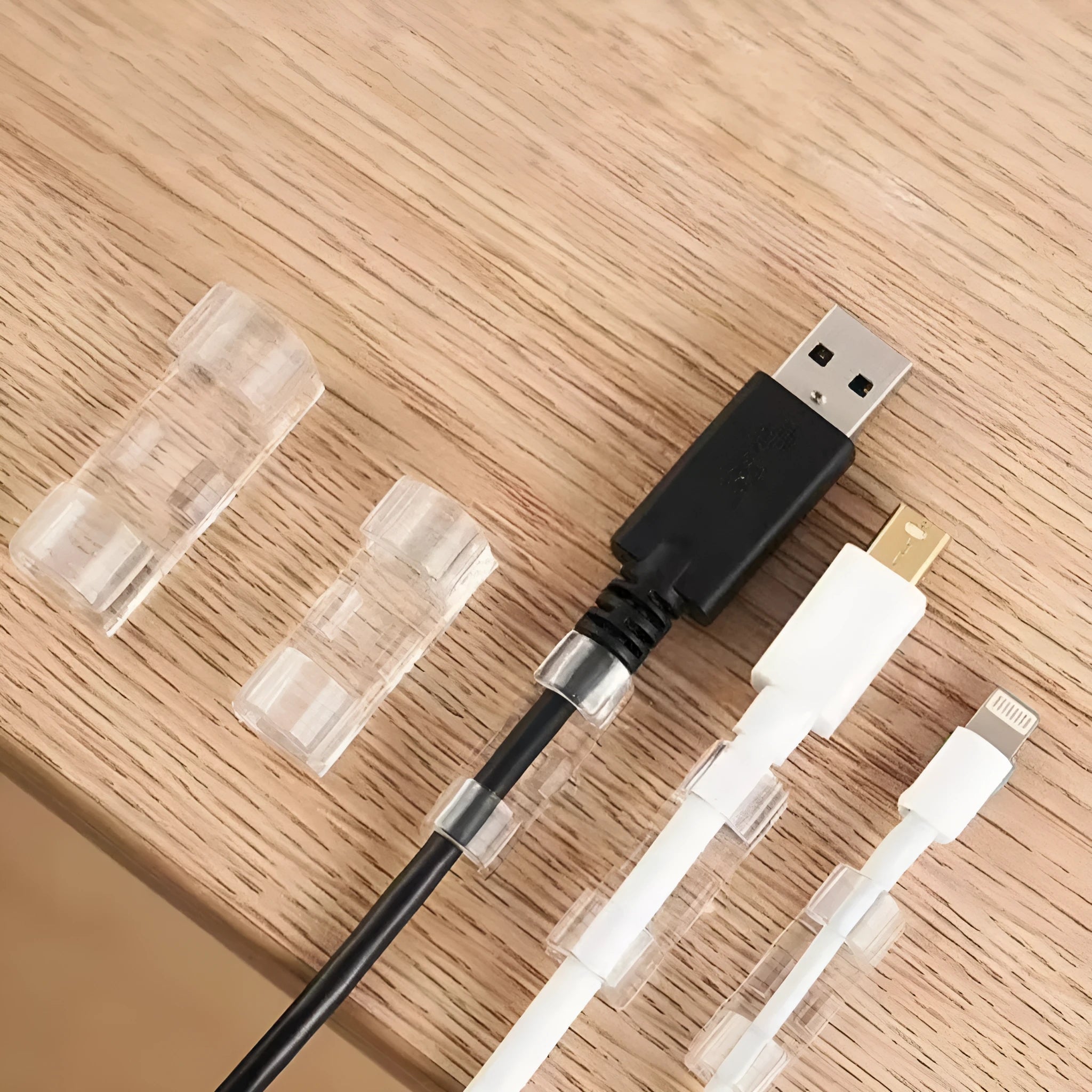 Transparent self-adhesive plastic cable management clips in a pack of 20 pieces.
