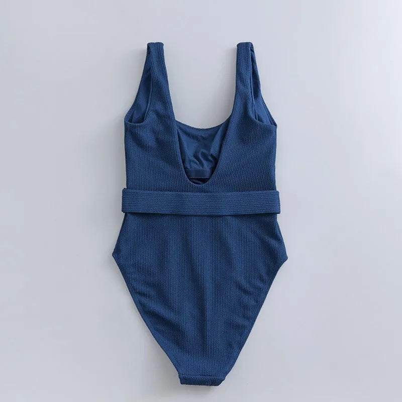 Navy blue women's one-piece swimsuit with chest padding and slim triangle design