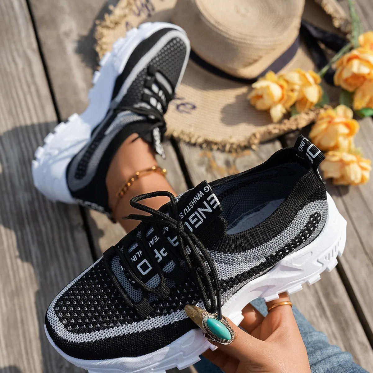 Women's Flyknit mesh lace-up sneakers in various colours with low flat heel and rubber sole