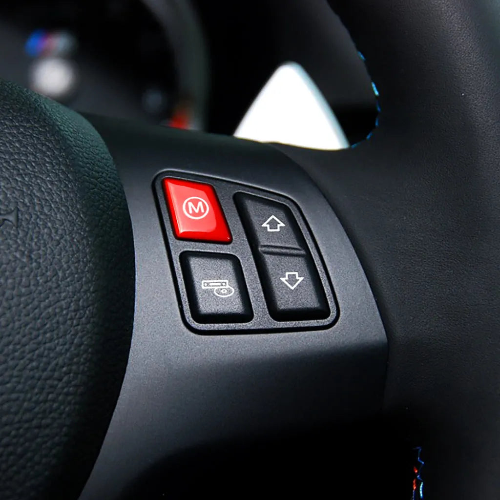 A pair of red M1M2 steering wheel mode buttons for BMW F30 and F34 models