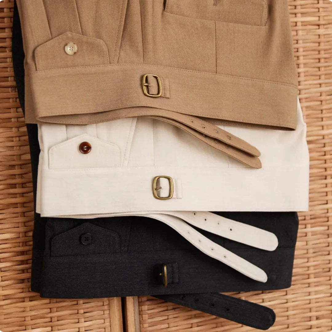 Men's slim fit straight leg business trousers in dark grey, shown in a professional setting.