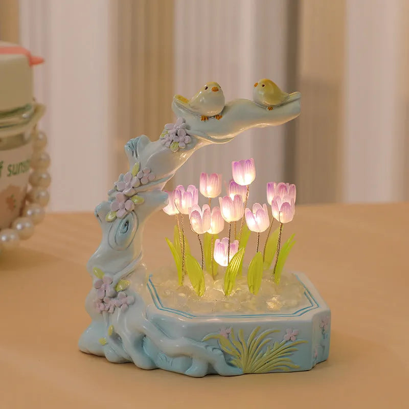 Resin tulip-shaped decorative night light assembled from DIY material package on a desk.