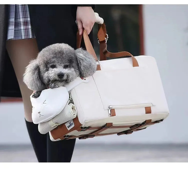 Hard-sided beige pet carrier with shoulder strap for cats and small dogs