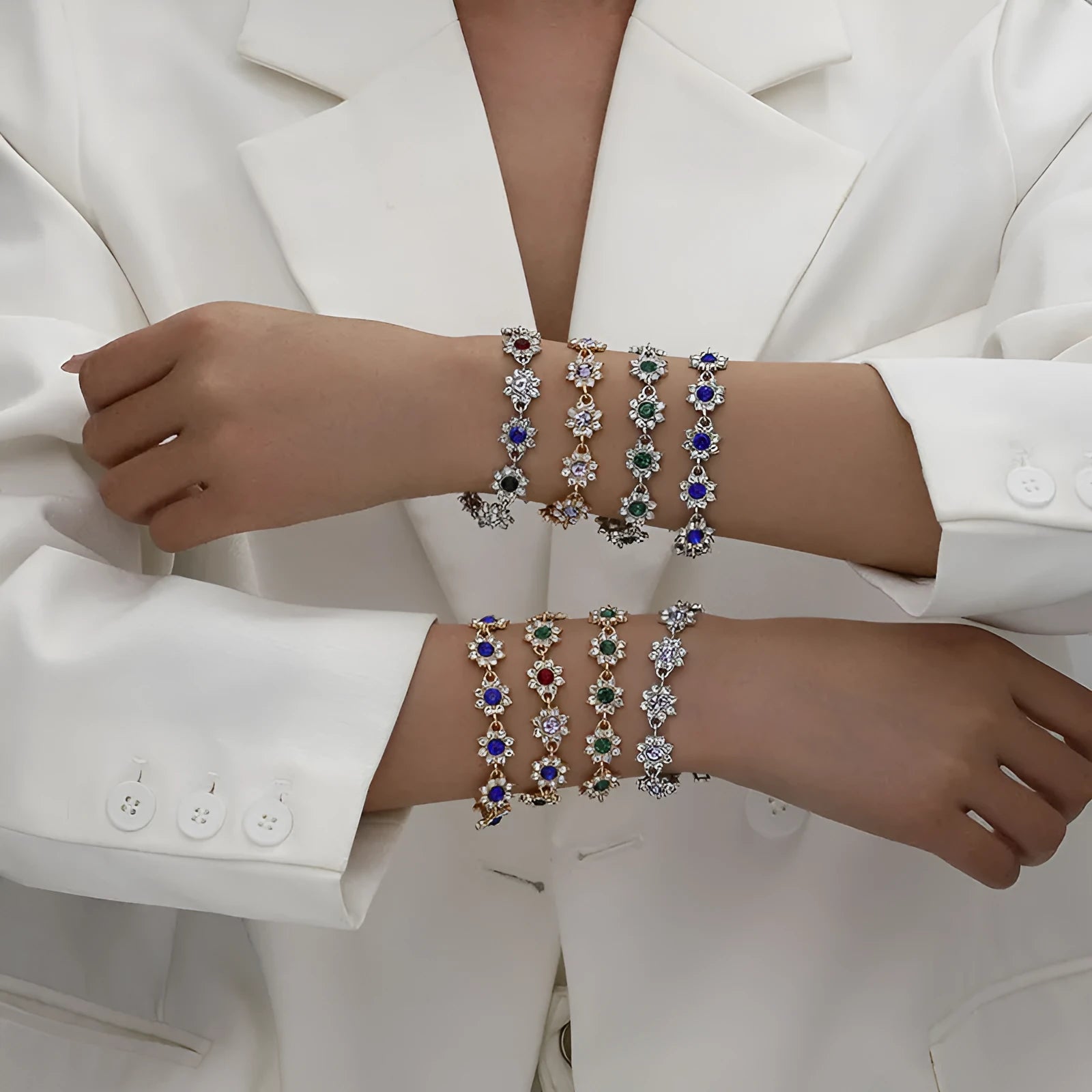 Adjustable zinc alloy bracelet with electroplated flower-shaped links in gold and silver colour options with gemstone accents.