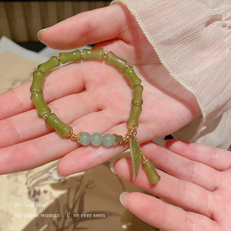 A Chinese style glass bead bracelet for women featuring bamboo joint design elements.