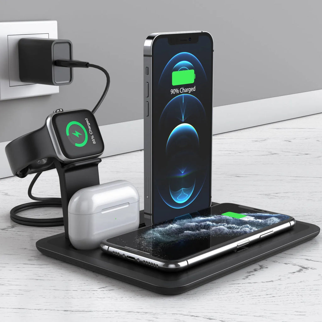 Black desktop wireless charging station with phone on pad, watch in bracket, and headphones on hook.