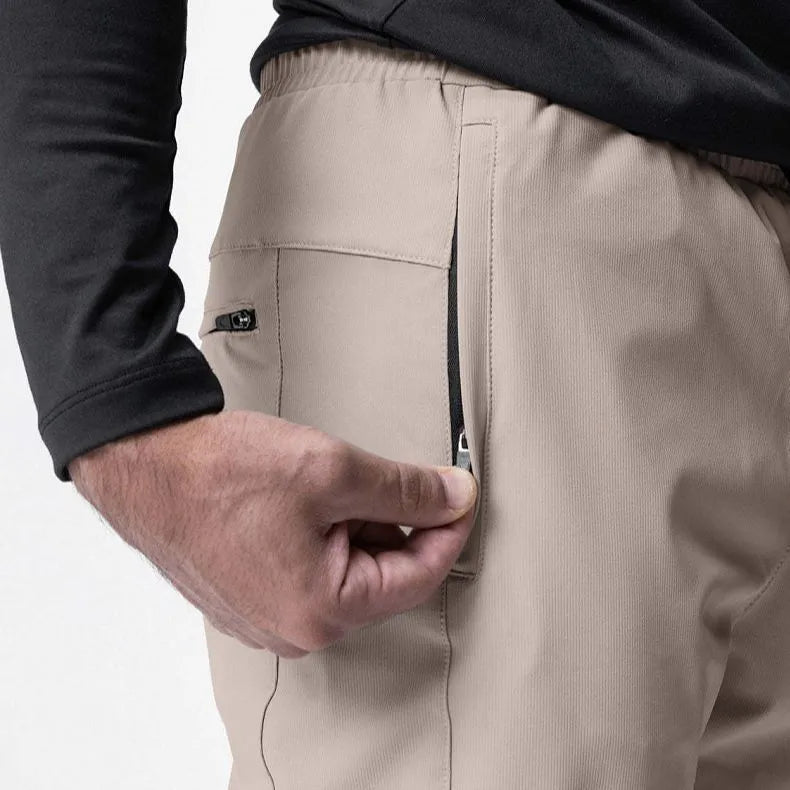 Men's grey loose-fit fitness trousers with ankle ties and quick-drying polyester fabric