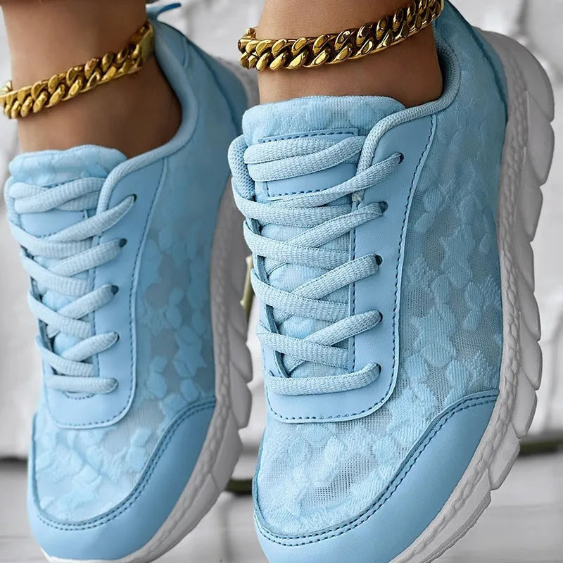 Women's canvas sports running shoes with flat heel in white, black, blue or pink colours