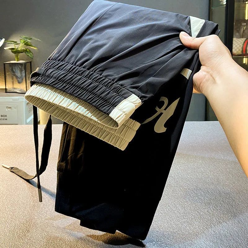 Black men's casual cropped trousers with an ankle band, made from ultra-thin ice silk cotton fabric.