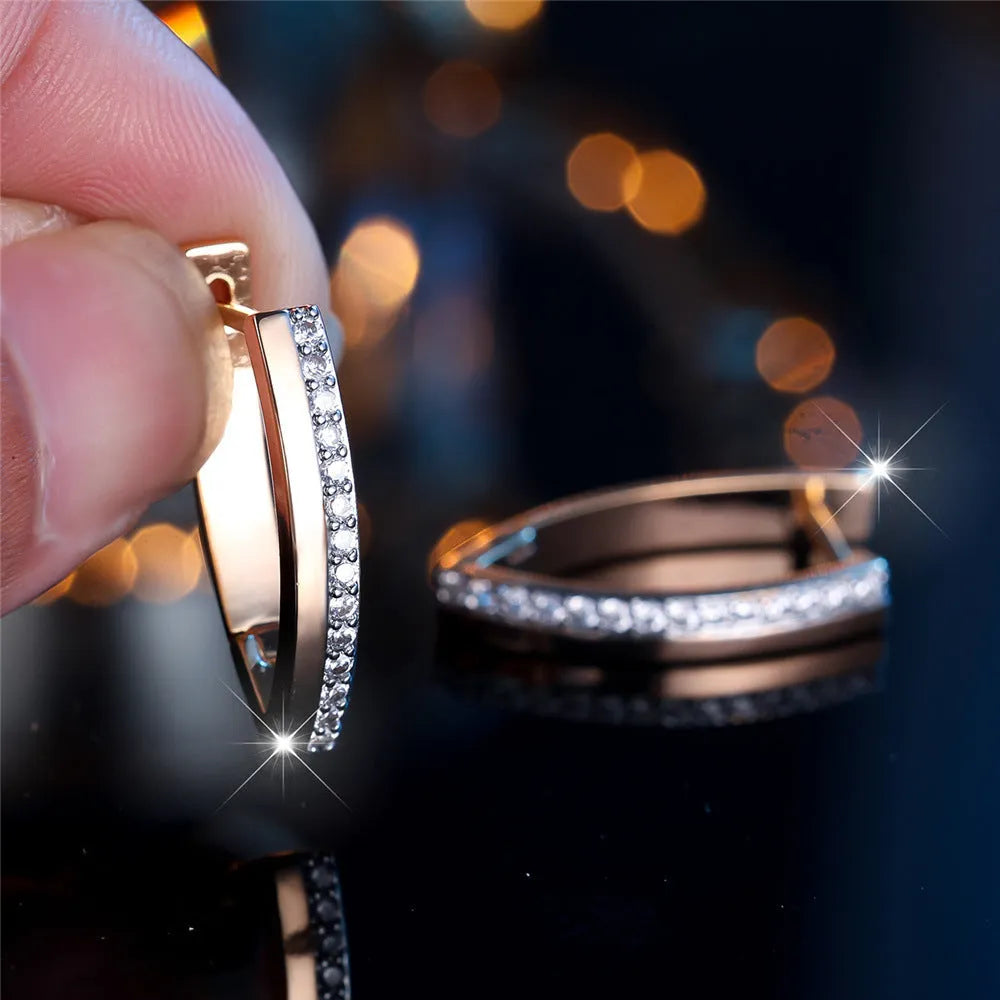 Geometric V-shaped women's earrings in champagne gold white diamond colour.