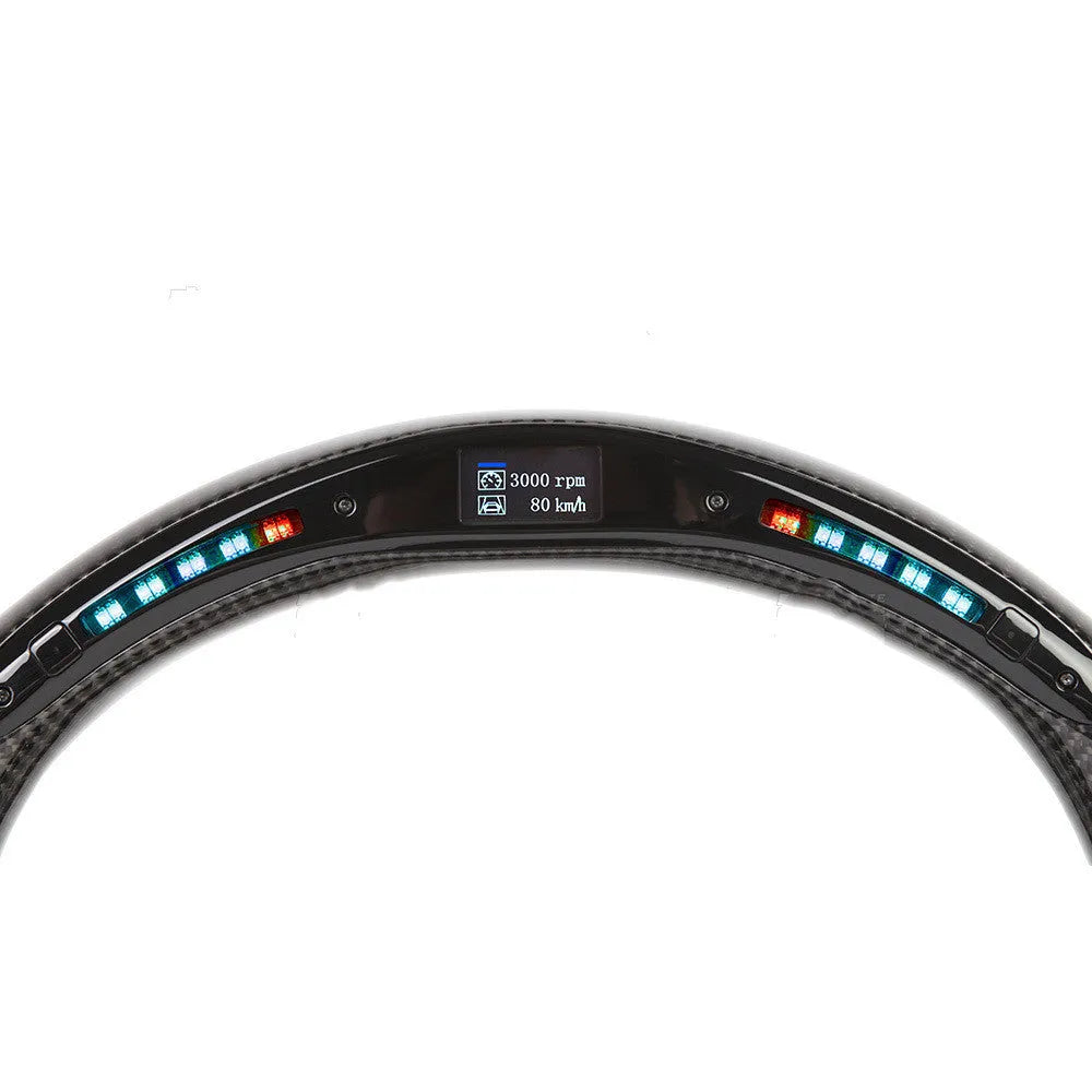 Black carbon fibre BMW sports steering wheel with integrated LED multifunctional display.