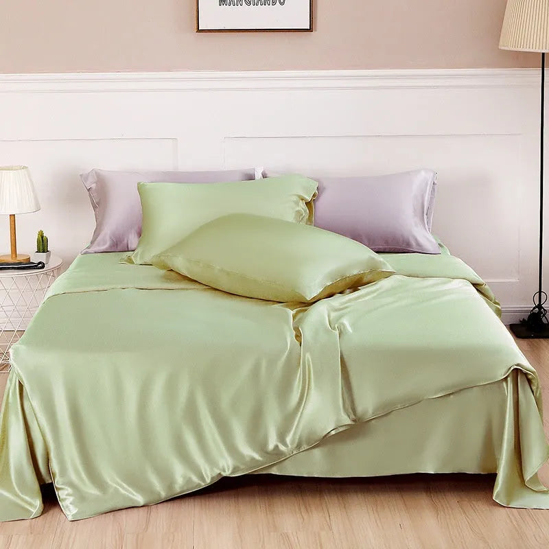 Solid colour silk duvet cover shown in Lotus Pink, double-sided design on a bed