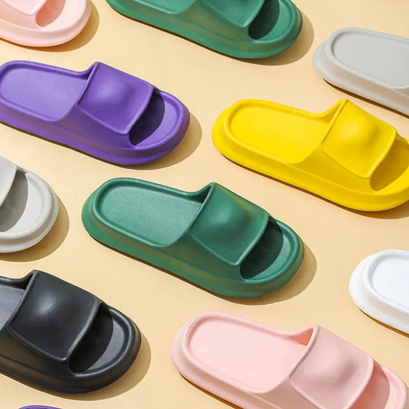 EVA flip-flop slippers with thick sole in assorted colours on a white background.
