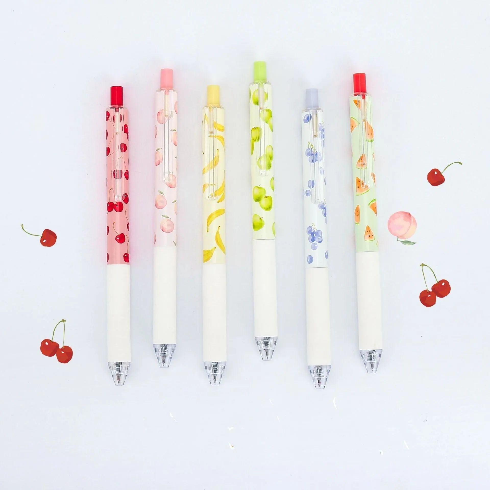 Three fruit scented press-action pens with 0.5mm black refills