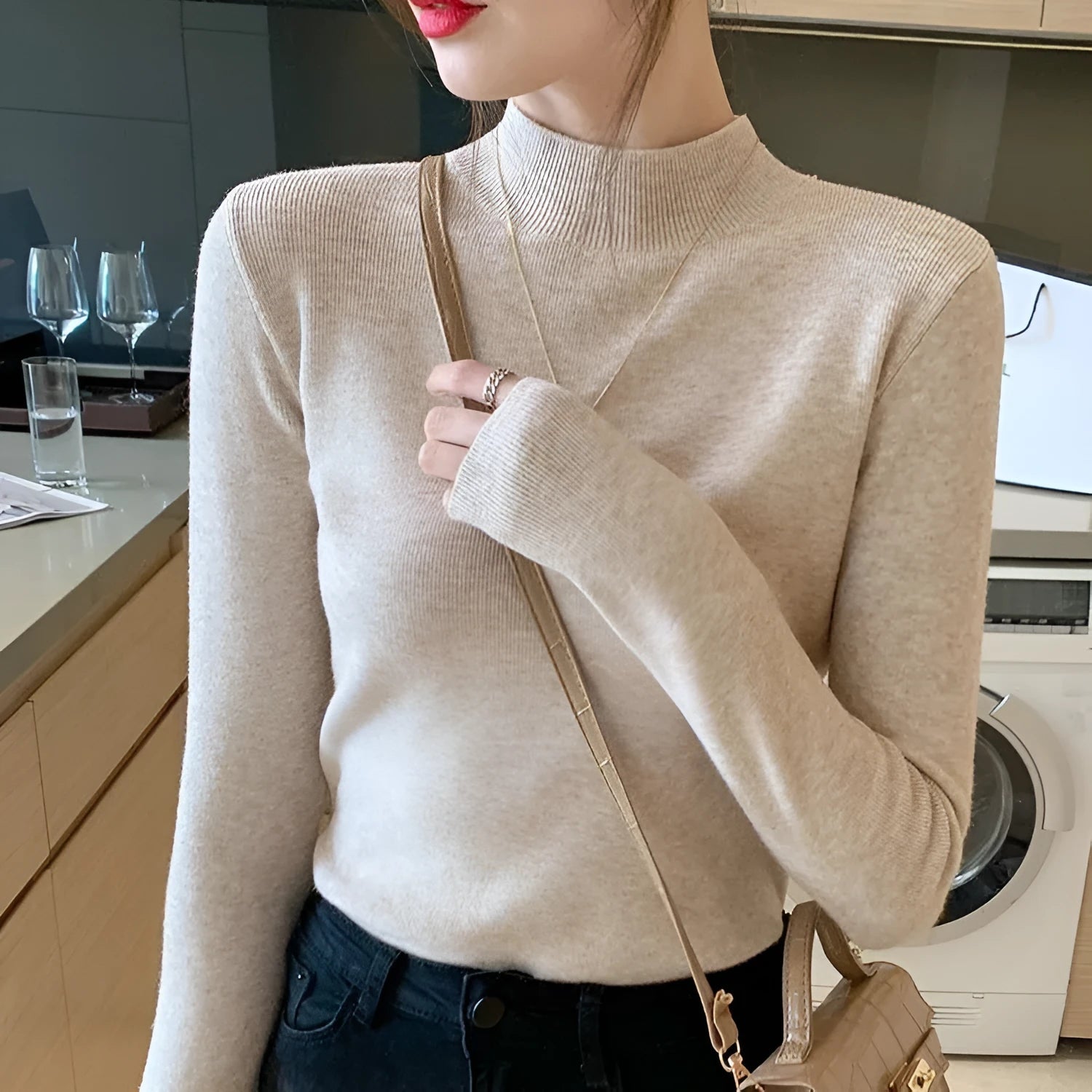 Women's slim fit viscose long sleeve top in apricot colour, showing front view.