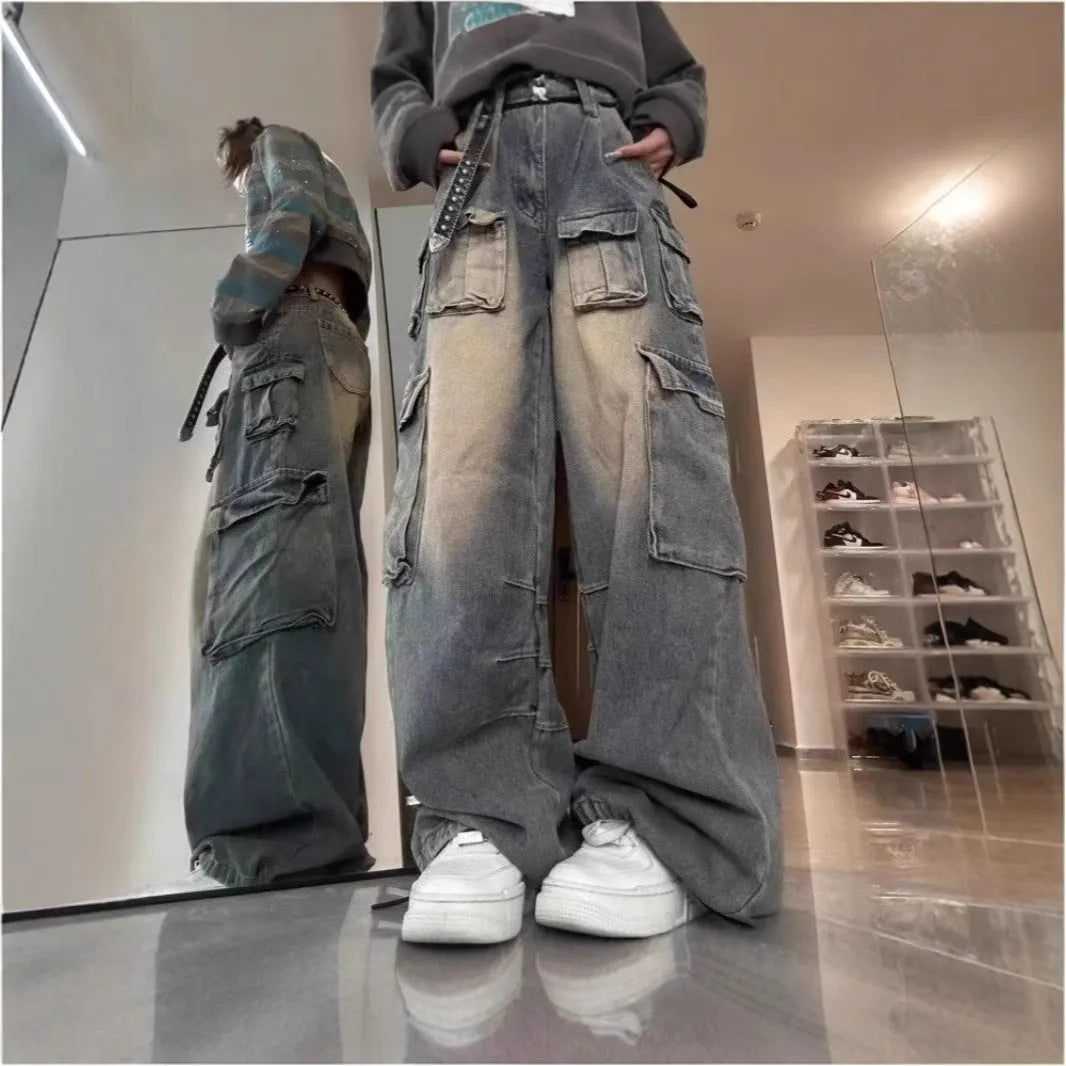 Multi-pocket loose distressed jeans in washed denim with straight-leg cut and tooling style pockets