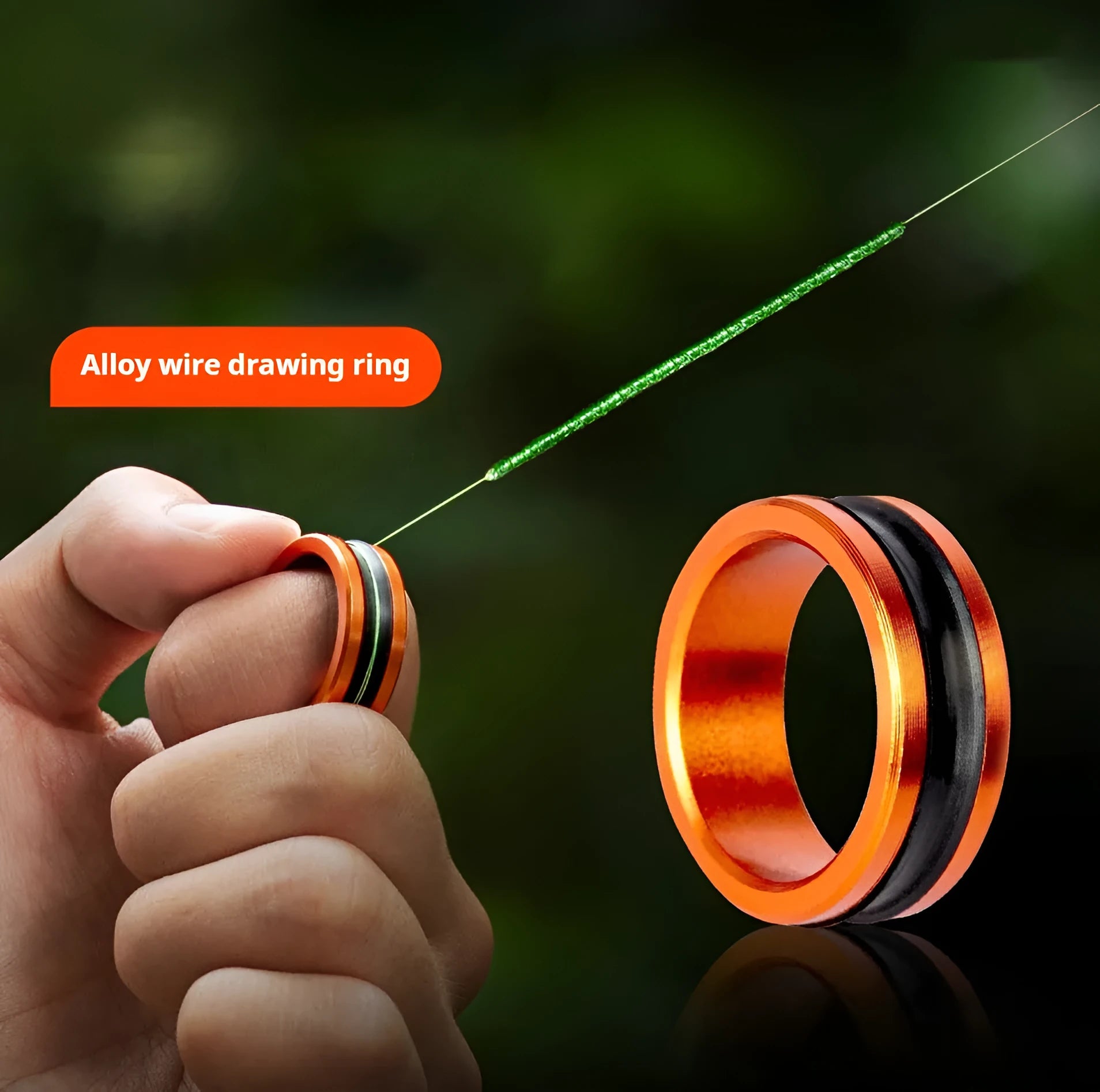 Orange and silver alloy fishing hand guard pull loop with non-slip grip.