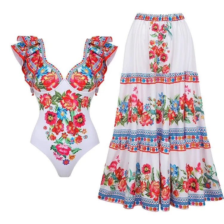 Women's printed one-piece swimsuit in various colours including rose pink, blue, and white.