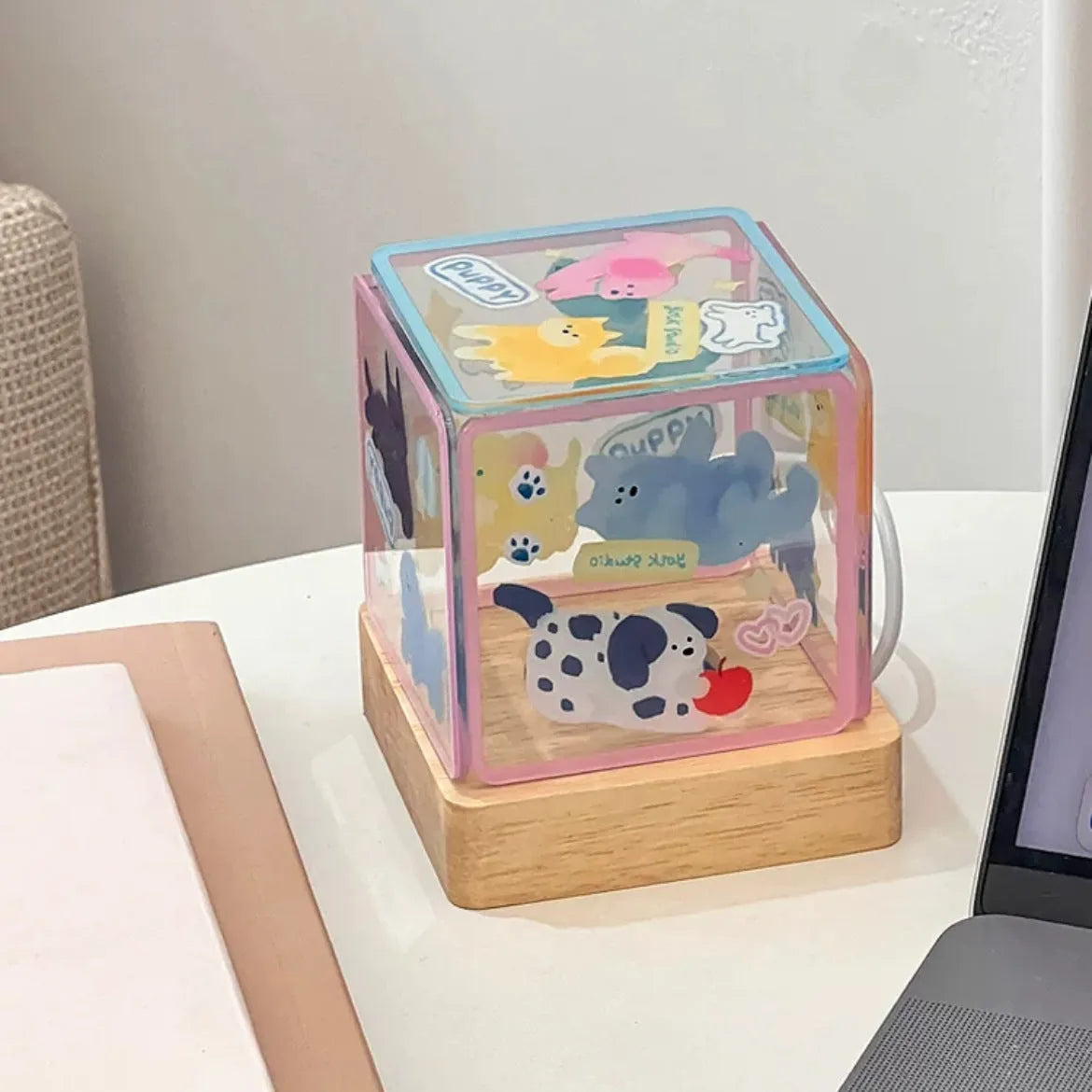 Acrylic self-adhesive USB small night lamp in kitten design, 8cm size, on a bedside table