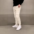 Men's light blue polyester casual trousers with patch pockets and elastic waistband in straight-leg baggy fit