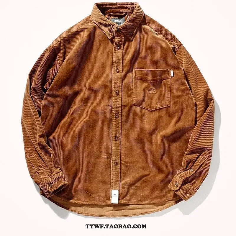 A man's loose-fit corduroy long sleeve casual shirt in caramel colour on a hanger.