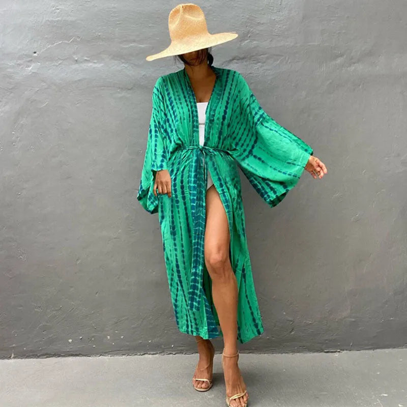 Women's printed loose-fit cotton beach cover-up shirt in rust red, open over a bikini.