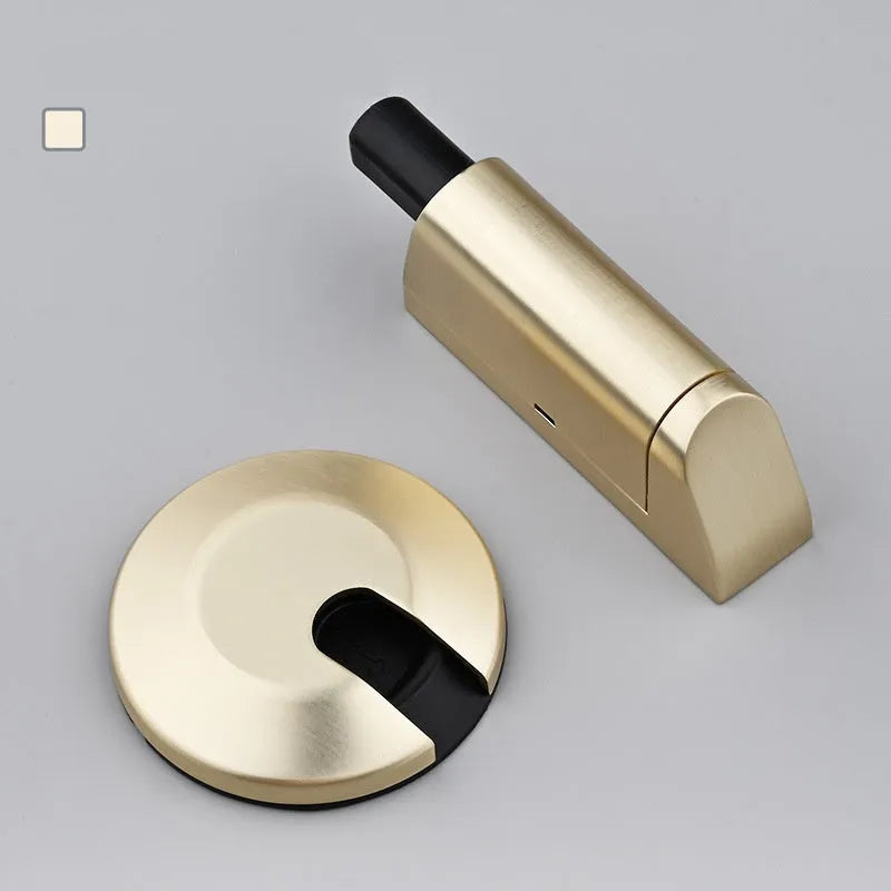 Zinc alloy wedge door stopper in six colour options on a wooden floor.
