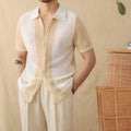 Beige linen-cotton blend short-sleeved cardigan with a lapel collar, laid flat.