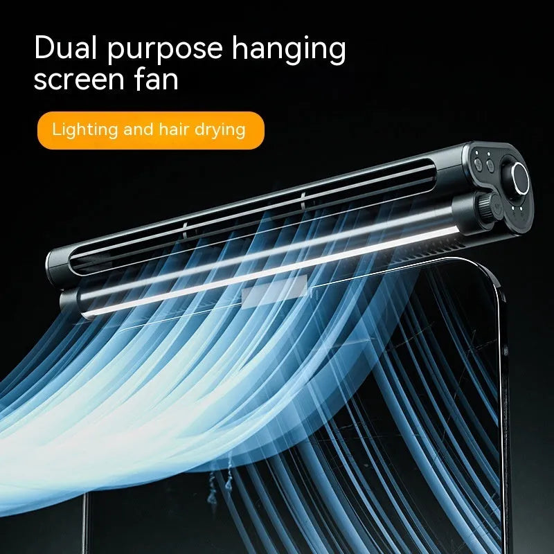 Black USB-powered bladeless clip-on laptop fan with integrated lighting lamp attached to computer screen