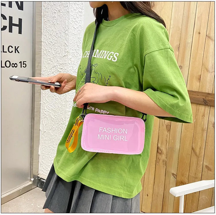 Transparent square jelly shoulder bag with adjustable strap showing internal mobile phone compartment