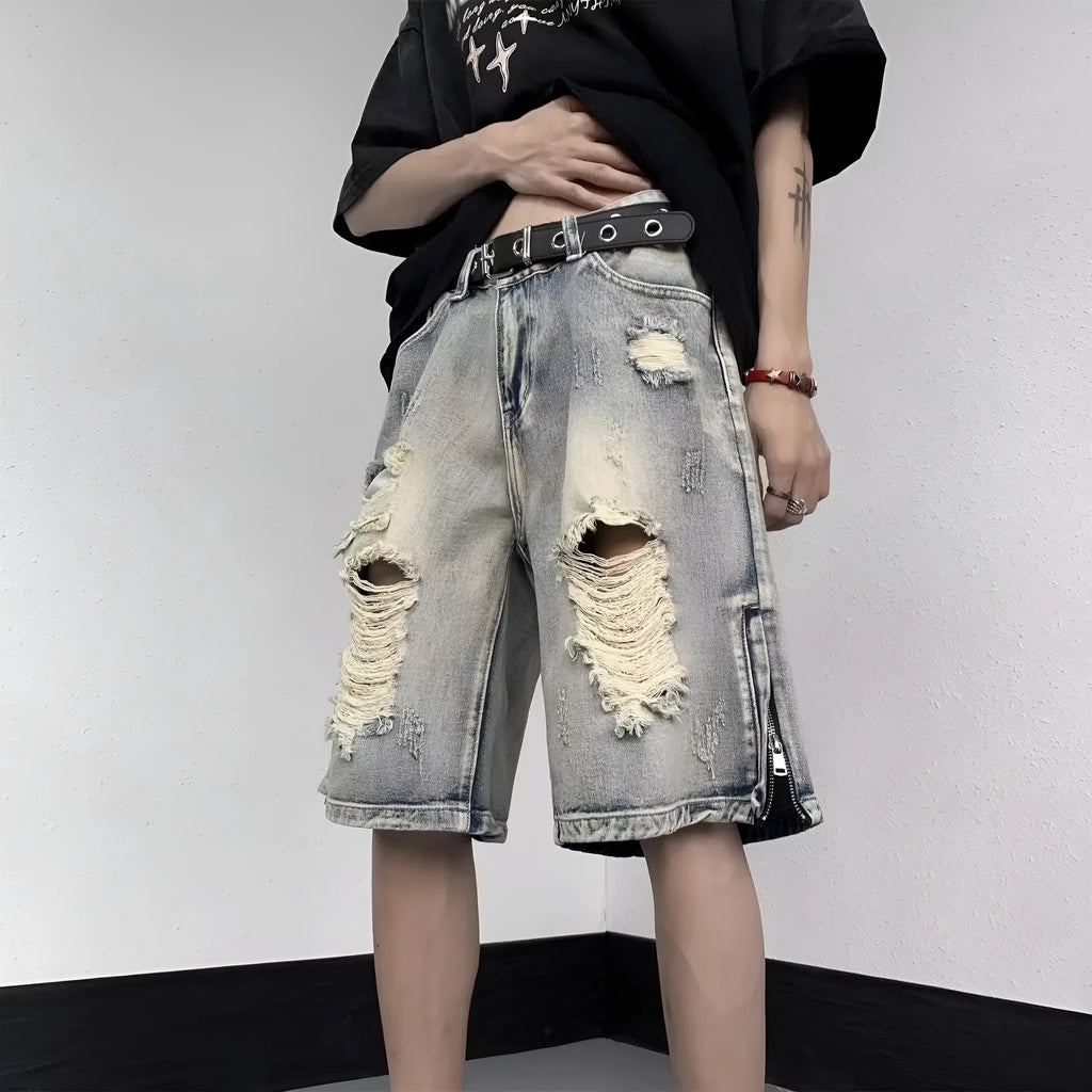 Blue retro tattered denim shorts with wide leg fit and distressed detailing