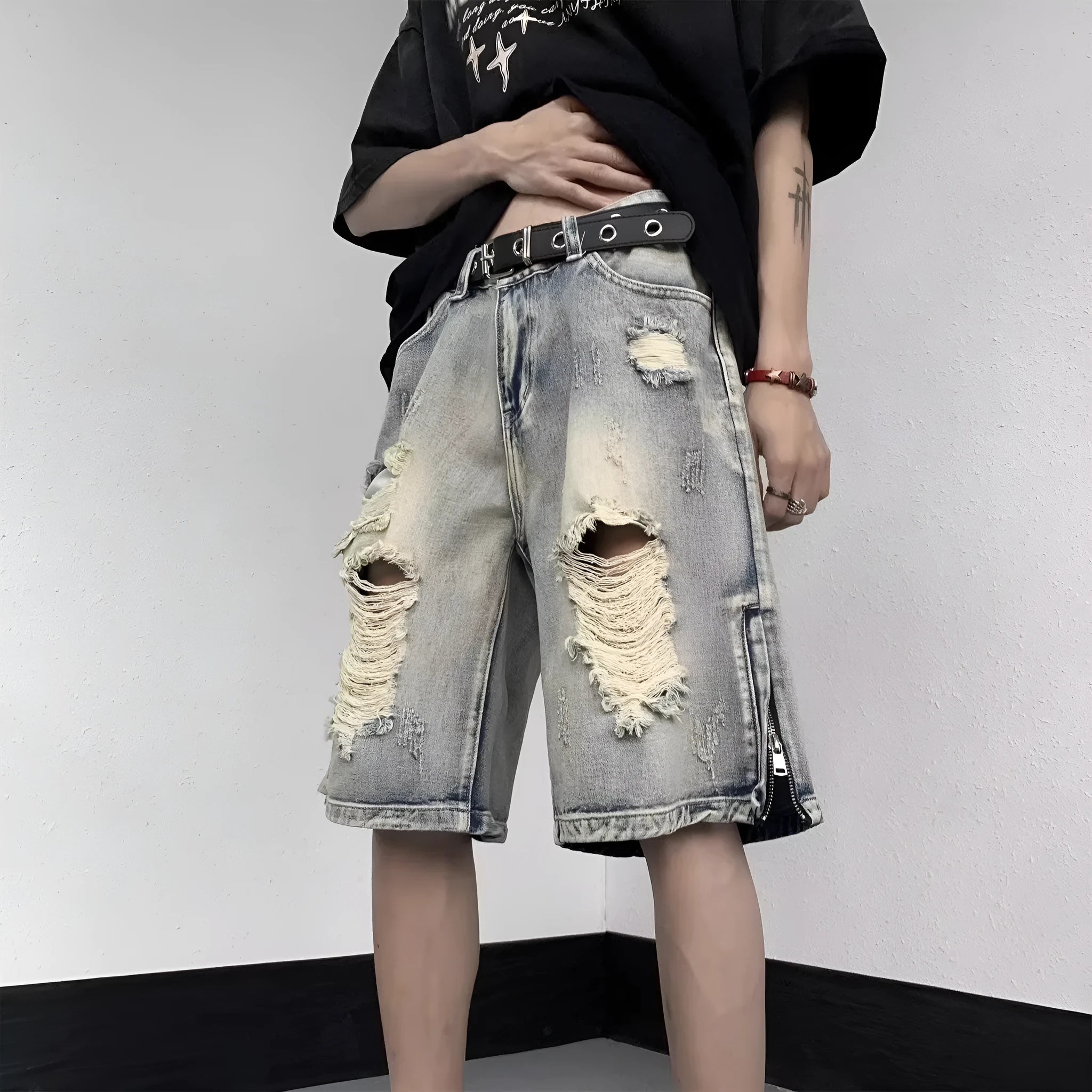 Blue retro tattered denim shorts with wide leg fit and distressed detailing