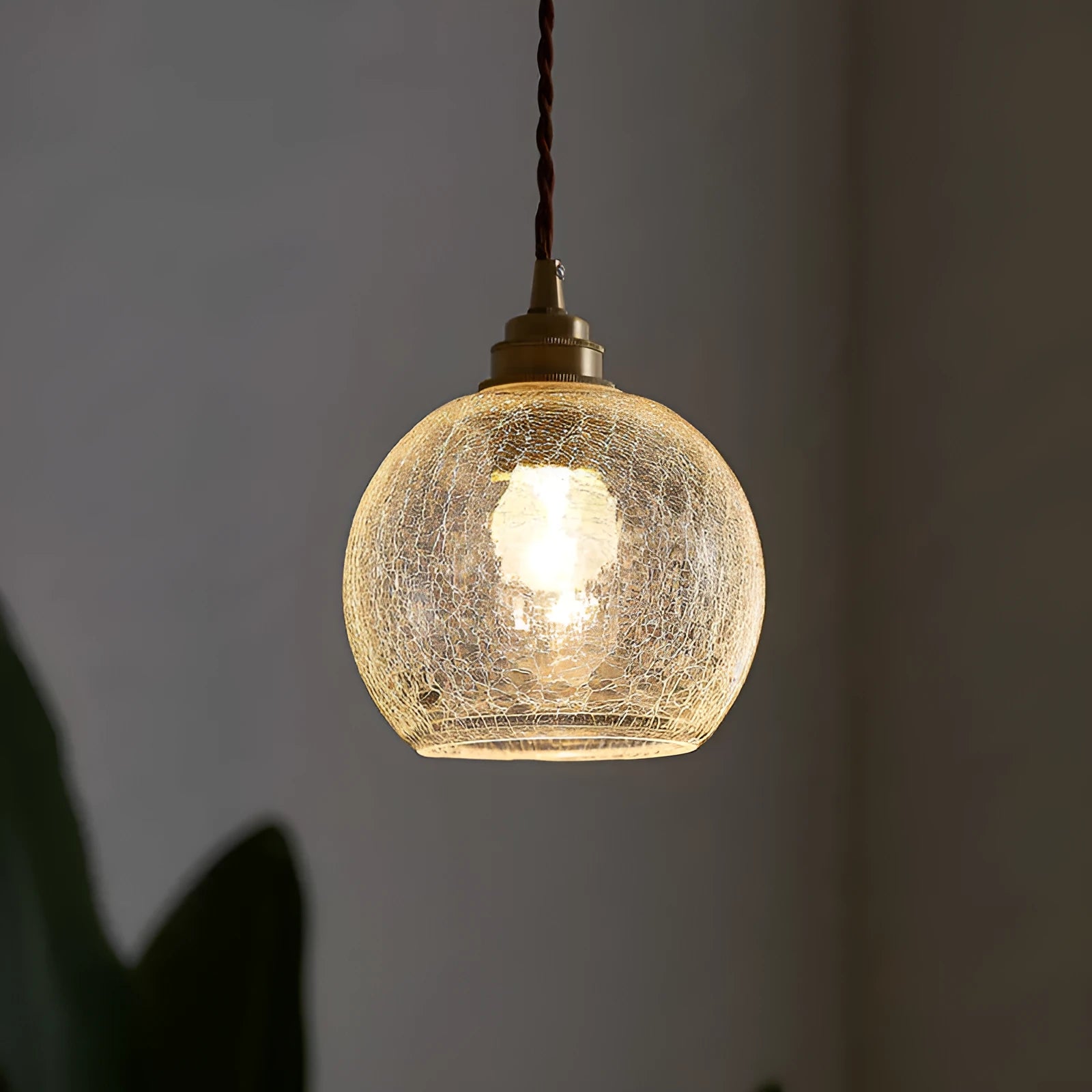 Retro brass and glass ball chandelier ceiling light with copper frame and spherical shade.