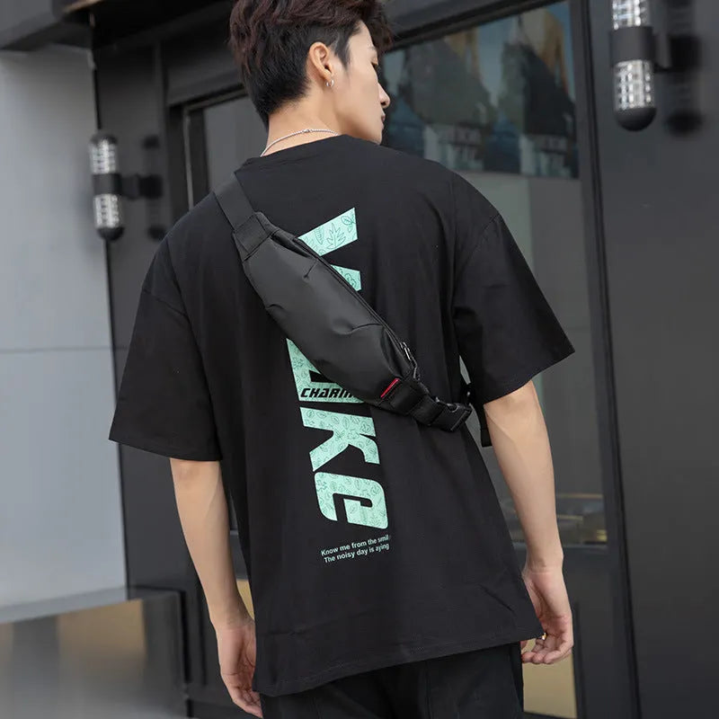 Black Oxford cloth men's waist pack with crossbody strap, showing internal phone and ID pockets.