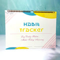 Habit tracking book with 12 pages showing colour options and 21x28cm size