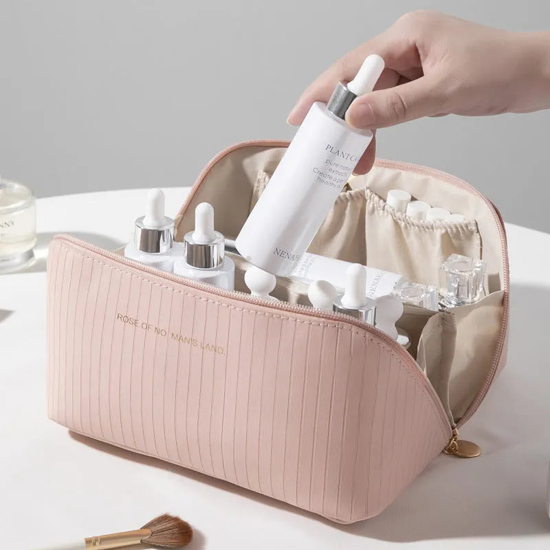 Vertical pattern pillow makeup bag showing cubic 22.5cm design with travel storage capacity