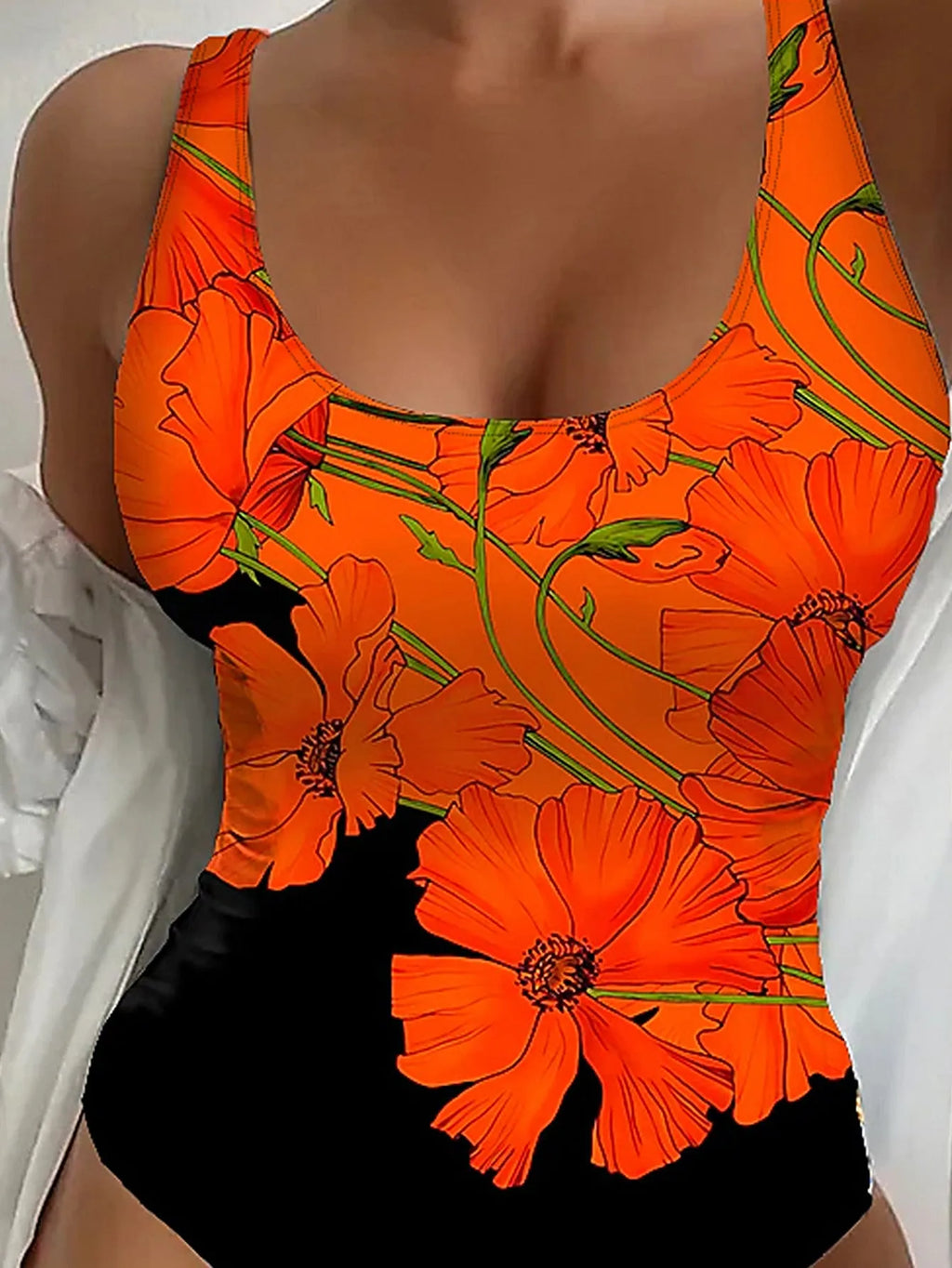 Women's orange floral print backless one-piece swimsuit on a model