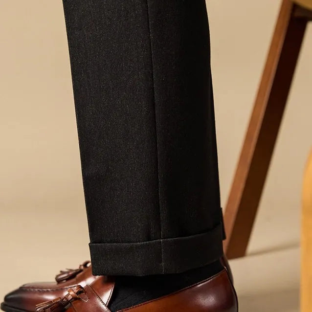 Men's genuine leather tassel loafers in black and brown colours showing polished uppers and rubber soles