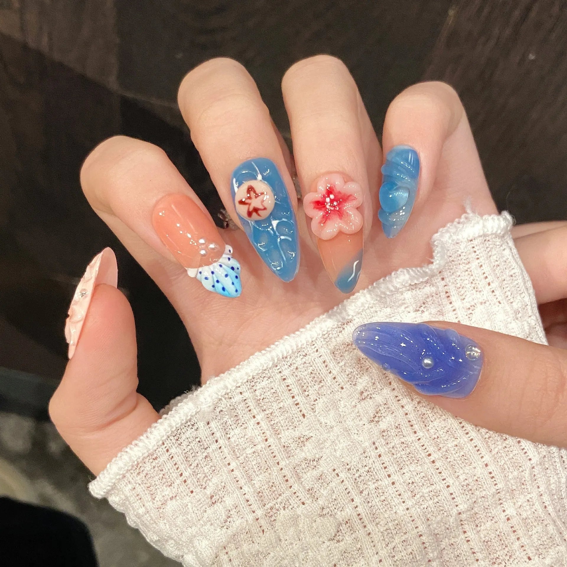 Three-dimensional carved jellyfish design on plastic wearable armour in almond nail colour